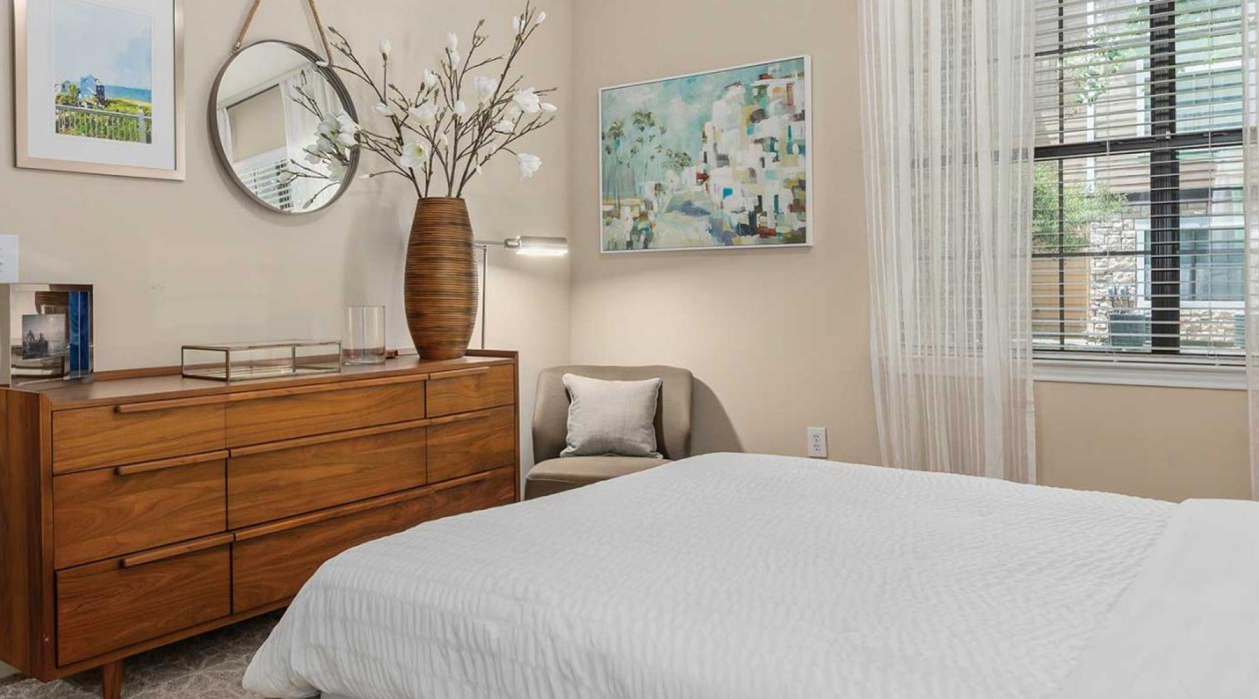 Generous bedroom offerings to fit every family a bedroom with a bed and a fan