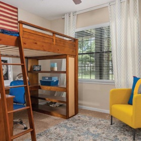 The essence of exceptional living a room with a bunk bed and a chair